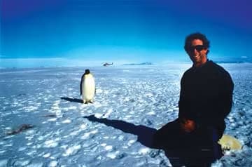 Chris Malzone with Emperor Penguin in Antarctica